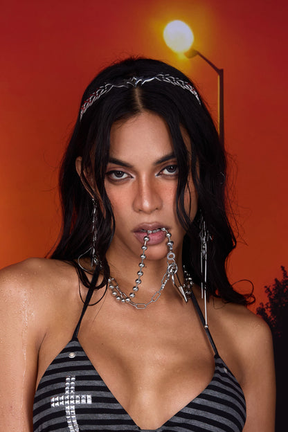 Fervooor Resort Crucifix Layered Necklace — layered silver bead chain held between lips, editorial styling