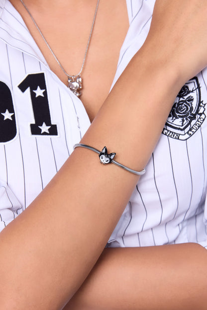 FEFE Dog Bracelet on model — silver snake chain bracelet with FEFE dog face charm, clean wrist shot with white pinstripe baseball shirt